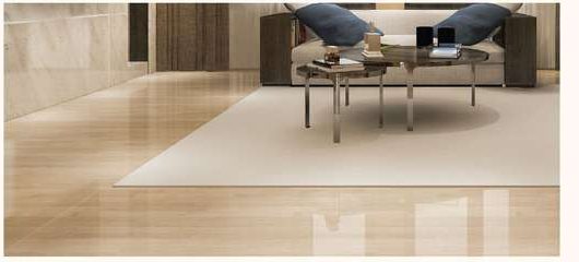 Polished large-format floor tiles running through a living room.