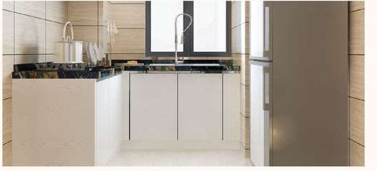 Kitchen with a dark stone counter, sink under a window and fitted cabinets.