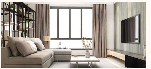 Living and dining room with a sofa, low table and wall-mounted television beside a window.